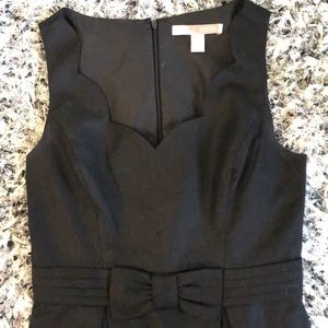 Black scalloped neck dress with bow accent